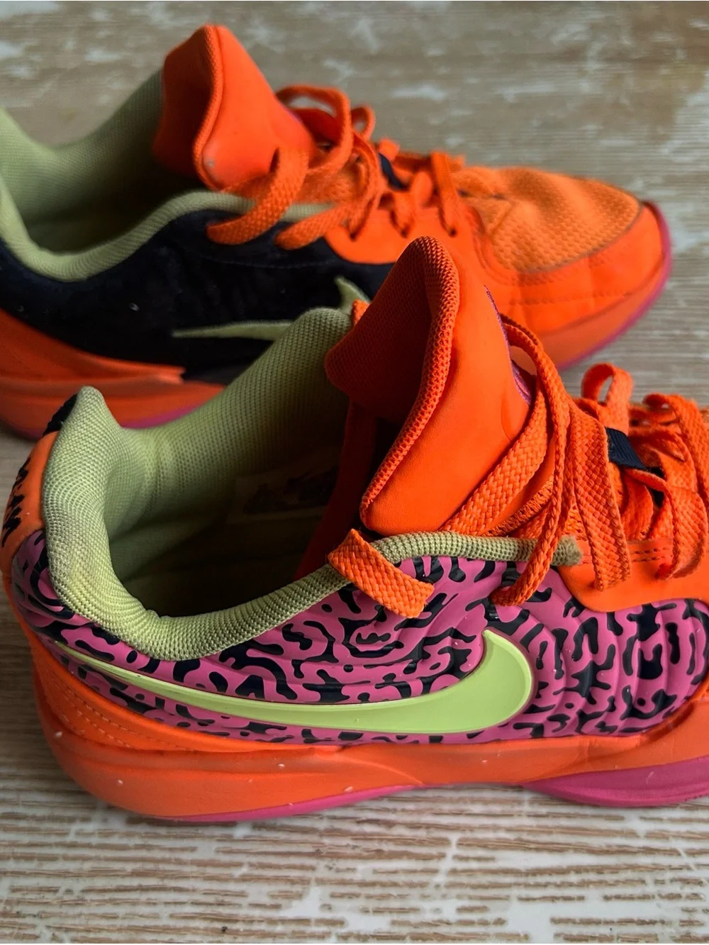 Nike Kids Low-Top Sneakers in Orange with Pink and Black Accents